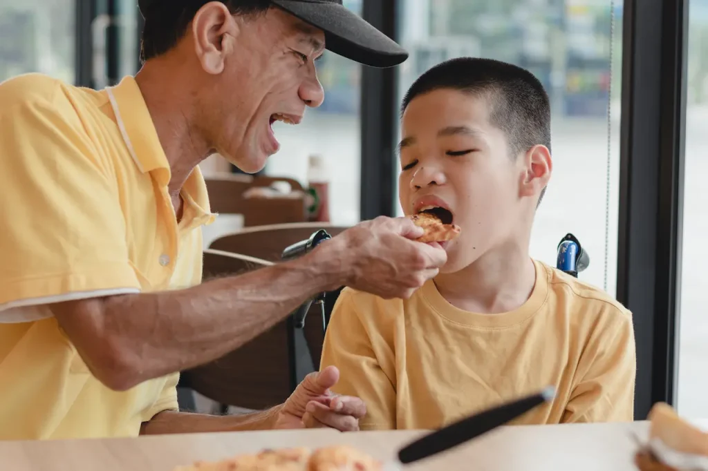 Disabled Child Eating Pizza 