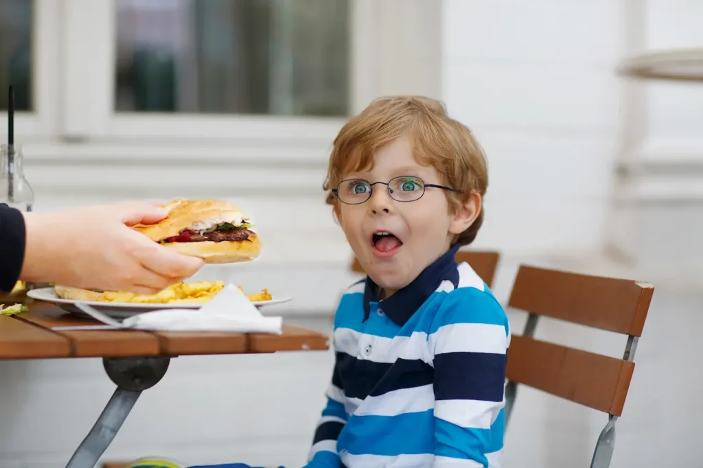 Little Boy Eating Burger 