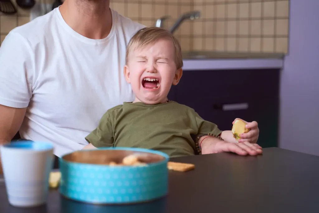 Small Kid Burst In Tears Beside His Father