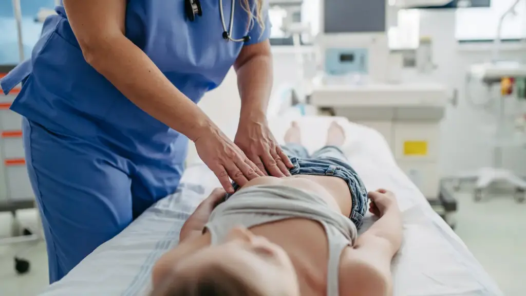 Doctor Checking Girl's Tummy